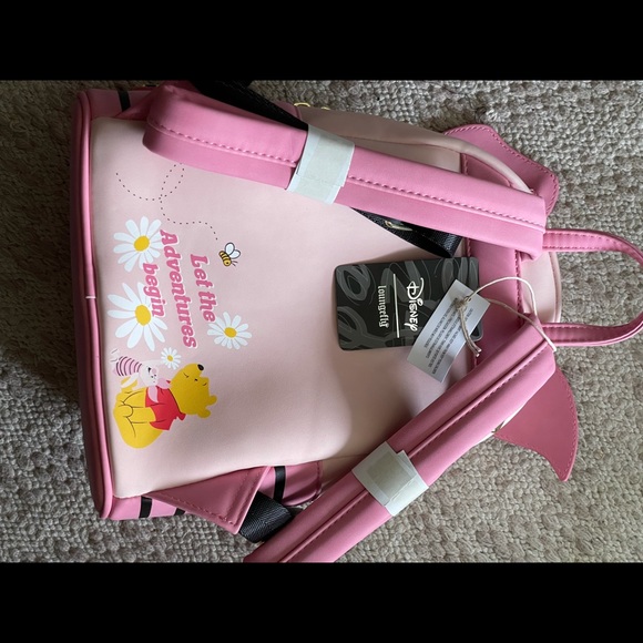 Piglet lounge fly book bag with tags